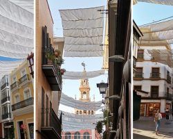 A mediados de un mes de julio tórrido, el Ayuntamiento aún no ha completado la instalación de los toldos en Sevilla